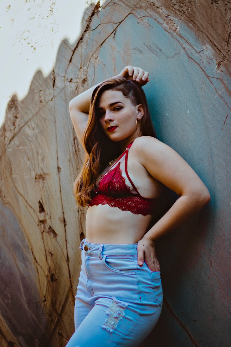 Woman Posing in a Lace Bra and Jeans